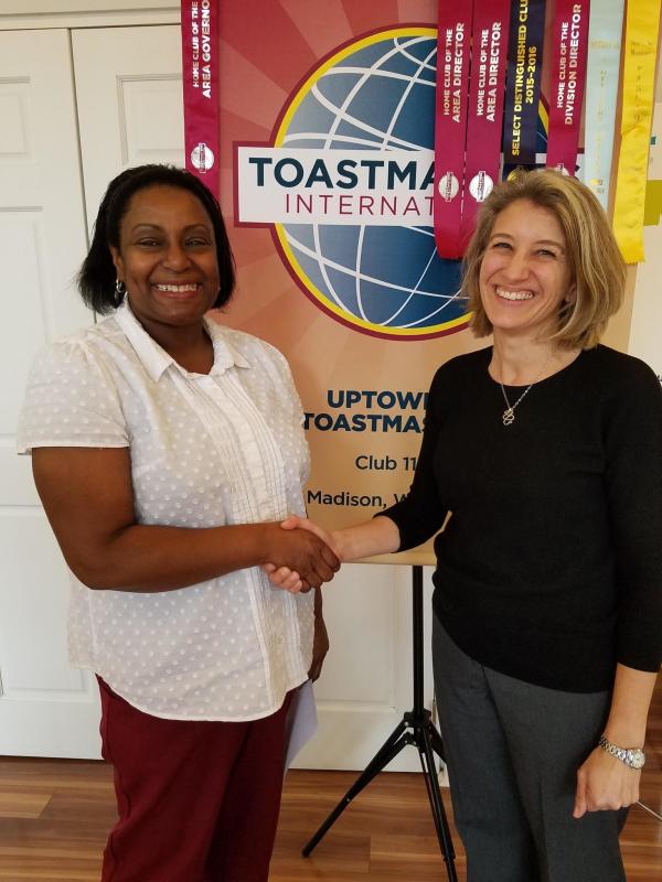 Image of Karen and Katie shaking hands after our table topics contest